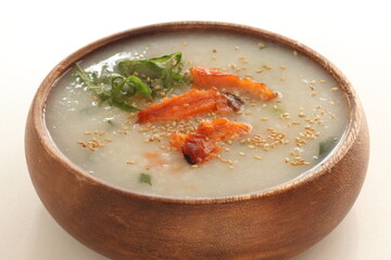 Grilled salmon fish and sesame seed in Chinese congee,