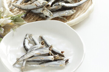 Japanese food ingredient,  dried small sardines on bamboo basket for broth cooking