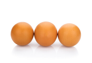 Three brown eggs arranged in a white background.