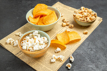 front view tasty cheese cips with different snacks for movie time on dark background potato cinema photo nuts food