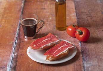 Traditional Spanish appetizer, tomato bread with Spanish ham.