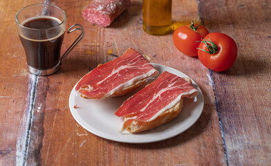 Traditional Spanish appetizer, tomato bread with Spanish ham.