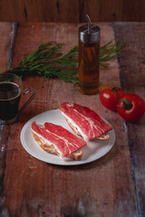 Traditional Spanish appetizer, tomato bread with Spanish ham.