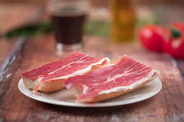 Traditional Spanish appetizer, tomato bread with Spanish ham.