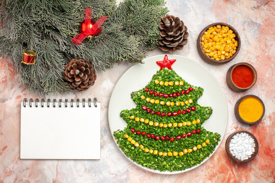 top view green salad in new year tree shape with seasonings on light background color salad meal xmas photo