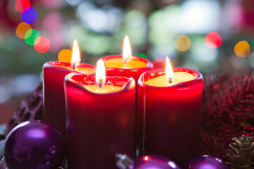 Obraz na płótnie Canvas Four red candles for Advent. Christmas background.