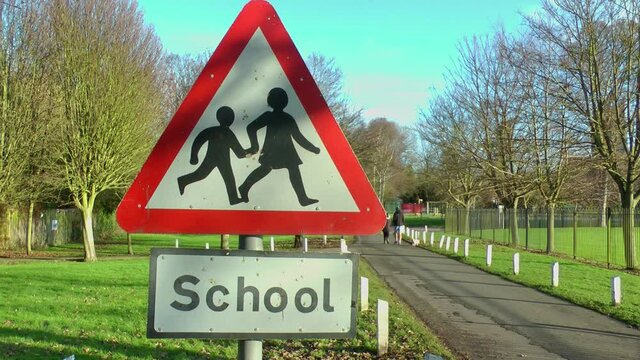 UK school crossing road sign.