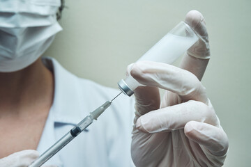 View of a Nurse preparing vaccine dose