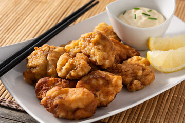 Spicy chicken karaage on wooden table