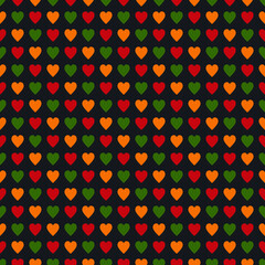 Seamless pattern with hearts in traditional Pan African colors - red, yellow, green, black background. Backdrop for Kwanzaa, Black history month, Black Love Day, Juneteenth greeting card. vector