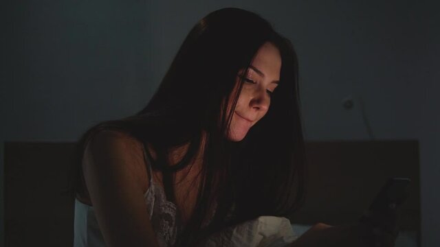 Young woman flips through the feed of&nbsp;social&nbsp;networks