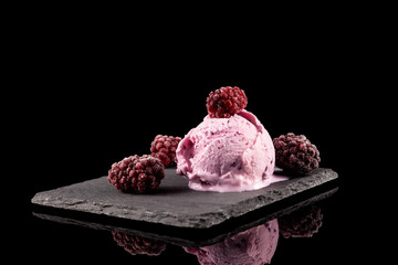 Melting blackberry ice-cream or sorbet with frozen berries on black background. Selective focus, copy space. Homemade Organic product - obrazy, fototapety, plakaty