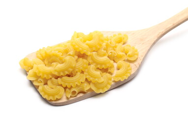 Pasta cornetti creste macaroni pile with wooden spoon isolated on white background