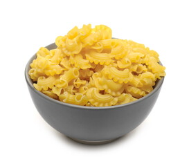 Pasta cornetti creste macaroni pile in porcelain bowl isolated on white background