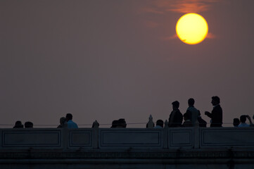 People at sunset in the Taj Mahal Exterior. Agra. Uttar Pradesh. India.