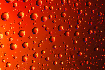 Abstract background about water or space. Multicolored stylish drops. Unusual splashes. It looks like the universe, planets and stars.