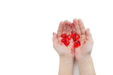 The girl is holding many bright red glass hearts with sparkles. Love concept. Layout for Valentine's Day. Isolate. View from above. Copyspace