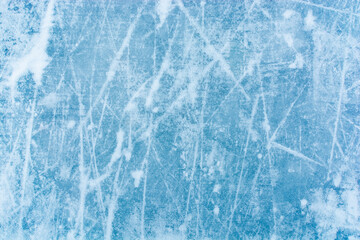 Blue ice background with stripes. Frozen water, sea. Frosty winter ice texture with scratches. Rink, skate.