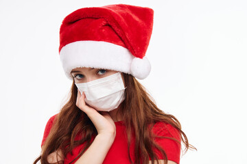 Fototapeta na wymiar cute girl medical mask christmas hat holiday cropped view