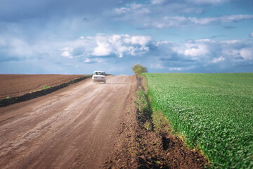 Car on country road landscape and beautiful clouds