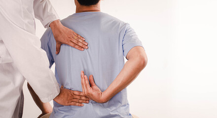 Doctors do physical therapy for young men and advise patients with back-waist problems.