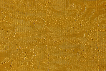 Modern contemporary acrylic background. Gold paint texture made with a brush. Luxury abstract...
