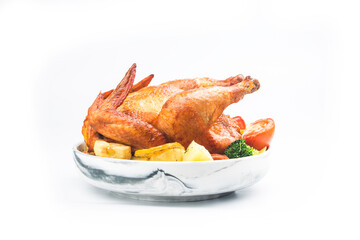 roasted chicken and vegetables on wooden table