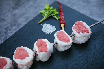 Skewers of fresh and raw shish kebab or barbecued shashlik meat. 