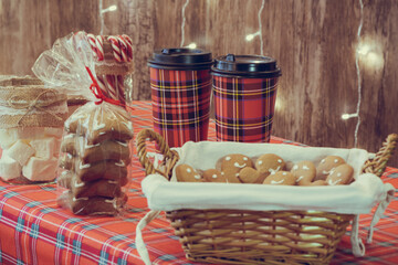 Christmas, New year pastry shop. Gingerbread, marshmallows, cookies, sweets hot chocolate and coffee on the counter in a small cozy cafe. Homemade bakery