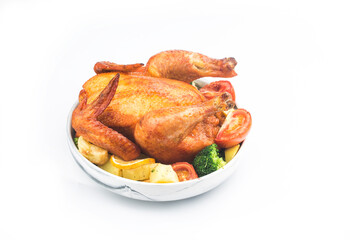 roasted chicken and vegetables on wooden table