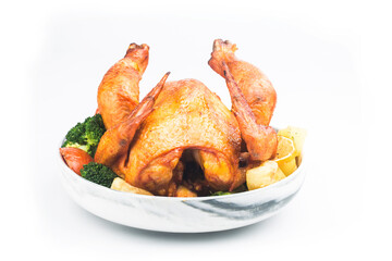 roasted chicken and vegetables on wooden table