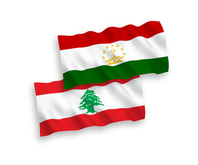 National vector fabric wave flags of Tajikistan and Lebanon isolated on white background. 1 to 2 proportion.