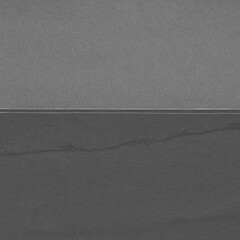 Fototapeta premium Black torn paper collage close-up. Texture made from various paper and cardboard parts. Damaged old paper background. Vintage blank wallpaper. Material design backdrop.