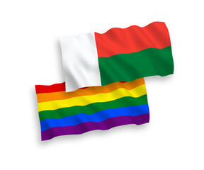 National vector fabric wave flags of Rainbow gay pride and Madagascar isolated on white background. 1 to 2 proportion.