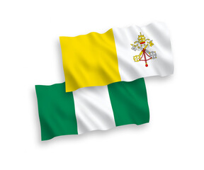 National vector fabric wave flags of Vatican and Nigeria isolated on white background. 1 to 2 proportion.
