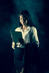Business woman wear formal white shirt Suit and check digital tablet