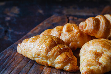 .Breakfast croissant bread on the wooden table