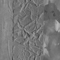 Black torn paper collage close-up. Texture made from various paper and cardboard parts. Damaged old paper background. Vintage blank wallpaper. Material design backdrop.