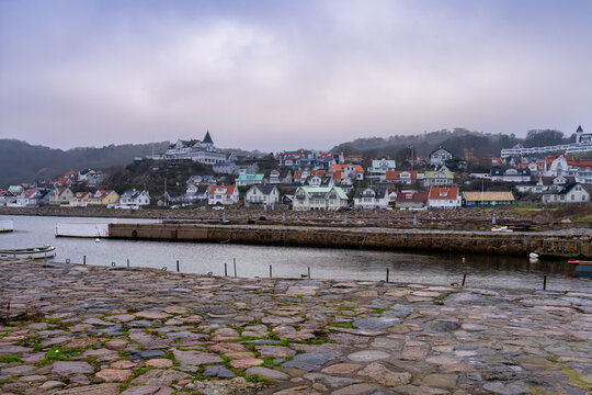 An empty marina in the winter. Mountains in fog in the background. Picture from Molle, Scania county, Sweden