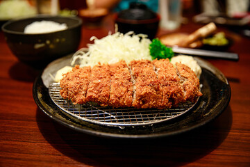 Tonkatsu set Japanese food, deep fried breaded pork cutlet with potato salad and sliced cabbage