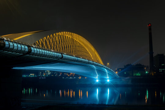 View of street lighting on "Troja bridge" on the Vltava river in the city of Prague at night 