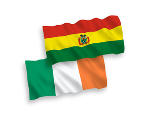 National vector fabric wave flags of Ireland and Bolivia isolated on white background. 1 to 2 proportion.