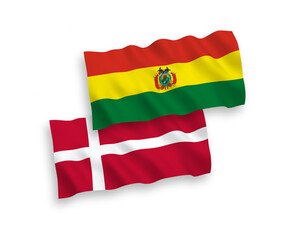 National vector fabric wave flags of Denmark and Bolivia isolated on white background. 1 to 2 proportion.