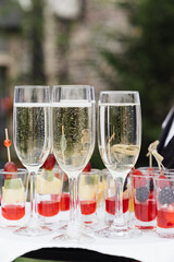 champagne glasses and shorts with berries. High quality photo