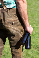 Bavarian man with bottles of beer in his hand