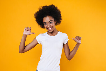 Happy african american girl smiling and pointing finger at herself