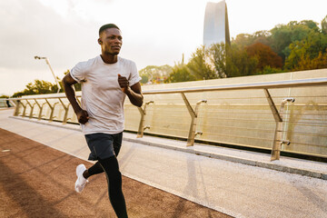 Confident young african man jogger exercising outdoors
