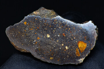 Small sample of hematite (iron ore) with a polished cut on a black background. Deposit Russia
