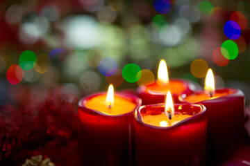Obraz na płótnie Canvas Four red candles for Advent. Christmas background.