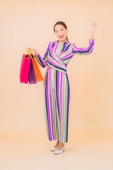 Portrait beautiful young asian woman with colorful shopping bag